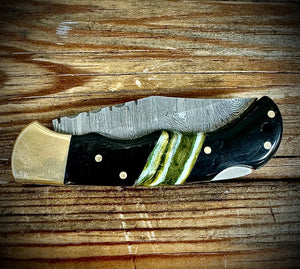 Bison horn and green Mammoth tooth