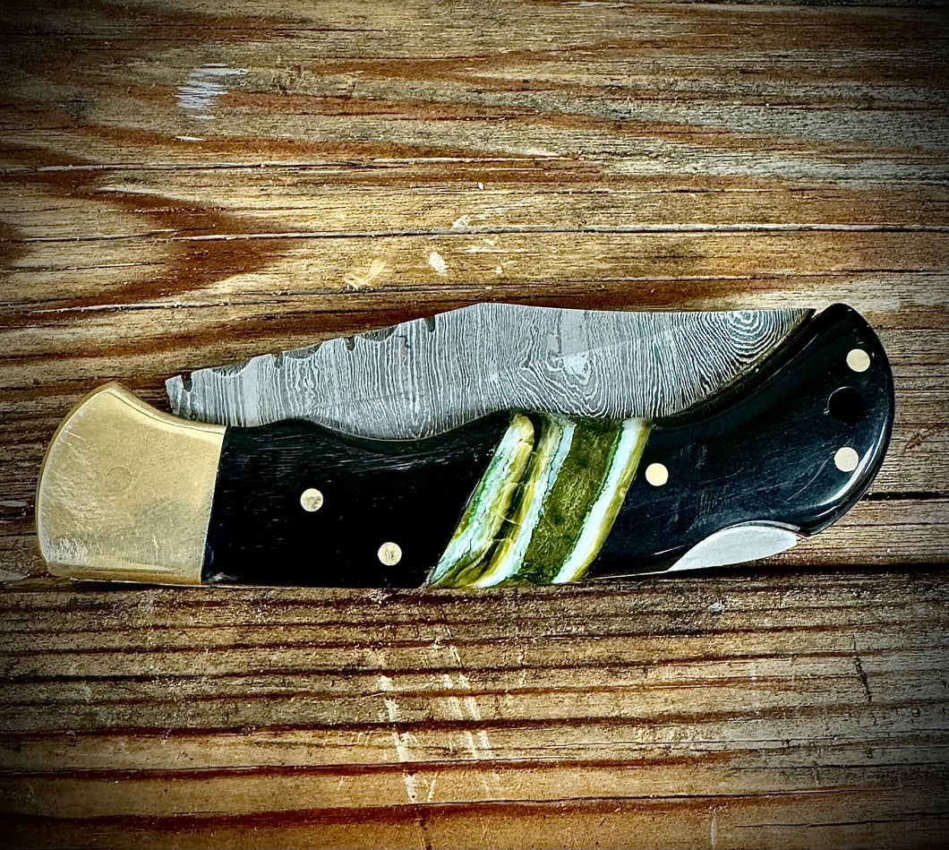 Bison horn and green Mammoth tooth